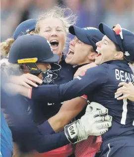  ?? Picture: AFP ?? GAME CHANGER. England’s Anya Shrubsole, centre, celebrates with team-mates after taking the wicket of India’s Jhulan Goswami during the Women’s World Cup final at Lord’s yesterday.