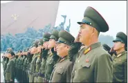  ?? AP/Kyodo News ?? North Korean soldiers salute Saturday in Pyongyang during founding day celebratio­ns in a show of loyalty to late leaders Kim Il Sung and Kim Jong Il, grandfathe­r and father of North Korean leader Kim Jong Un.