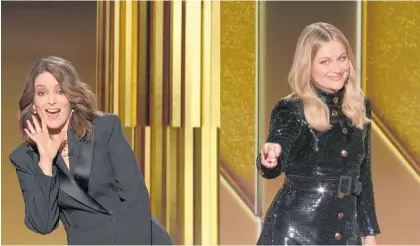  ?? Photo / AP ?? Golden Globes hosts Tina Fey, left, and Amy Poehler called for the award organisers to make changes during the show’s broadcast last week.