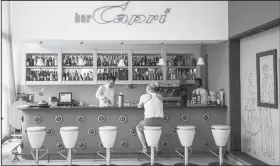  ?? AP/DESMOND BOYLAN ?? A customer sits Tuesday at the lobby bar of the Hotel Capri in Havana, Cuba. The recently renovated hotel was one site of mysterious “health attacks” on U.S. diplomats in Cuba, officials said.