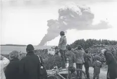  ?? PICTURE: GETTY ?? People at Land’s End, Cornwall, watching the bombing of the stricken tanker the Torrey Canyon on this day in 1967