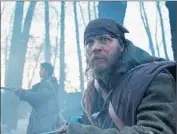  ??  ?? TOM HARDY and in the background Will Poulter in a scene from best picture nominee “The Revenant.”