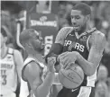  ?? ALONZO ADAMS/USA TODAY SPORTS ?? Spurs forward LaMarcus Aldridge, right, works to keep the ball away from Thunder guard Chris Paul on
Feb. 11 at Chesapeake Energy Arena.