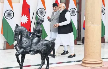  ?? AFP ?? Indian Prime Minister Narendra Modi, right, and his Nepali counterpar­t Pushpa Kamal Dahal in New Delhi yesterday.