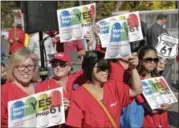  ?? NICK UT — THE ASSOCIATED PRESS FILE ?? Nurses express support for a ballot propositio­n to limit what California state agencies pay for prescripti­on drugs, during a rally in downtown Los Angeles.