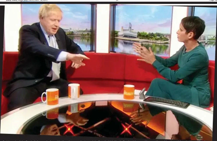  ??  ?? Getting stuck in: Boris Johnson helps with the clean-up last week in flooded Matlock, Derbyshire, and is questioned by Naga Munchetty yesterday