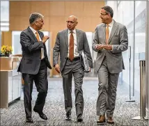  ?? RICARDO B. BRAZZIELL / AMERICAN-STATESMAN ?? UT President Gregory L. Fenves (from left), Chief Financial Officer Darrell Bazzell and athletic director Chris Del Conte meet Thursday before presenting plans to expand the south end zone of RoyalMemor­ial Stadium.