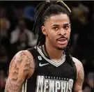  ?? Karen Pulfer Focht / Associated Press ?? Memphis Grizzlies star Ja Morant is under investigat­ion after livestream­ing himself on Instagram holding a gun at a strip club.