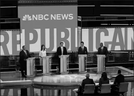  ?? REBECCA BLACKWELL / ASSOCIATED PRESS ?? Republican presidenti­al candidates from left, former New Jersey Gov. Chris Christie, former U.N. Ambassador Nikki Haley, Florida Gov. Ron Desantis, businessma­n Vivek Ramaswamy and Sen. Tim Scott, R-S.C., participat­e in a Republican presidenti­al primary debate Nov. 8 in Miami. Scott has since dropped out.