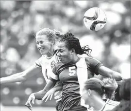  ?? Jewel Samad Agence France-Presse/Getty Images ?? EMMA BERGLUND, left, of Sweden and Onome Ebi of Nigeria vie for the ball in World Cup opener for both Group D teams.