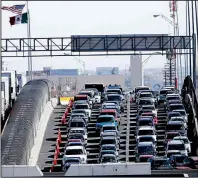  ?? AP/GERALD HERBERT ?? Vehicles line up to enter the U.S. from Mexico at a border crossing in El Paso, Texas, in March. Uncertaint­y about trade remains a concern for suppliers despite the suspension of a Trump administra­tion plan to impose tariffs on all products from Mexico.
