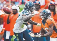  ?? AAron Ontiveroz, The Denver Post ?? Broncos receiver Emmanuel Sander makes a catch while defended by Seattle’s Tre Flowers at Broncos Stadium at Mile High on Sunday.