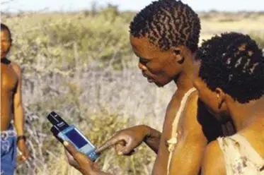  ??  ?? OFF-TRACK: Bushmen with GPS