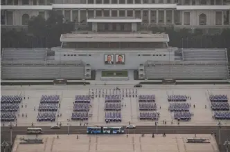  ?? — AFP ?? PYONGYANG: A photo taken on July 24, 2017 shows groups of people gathered on Kim Il-Sung square ahead of ‘Victory Day’ celebratio­ns.