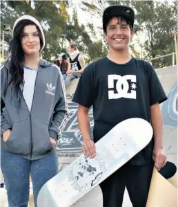  ??  ?? Chantal Graaf of Minority Skate with 16-year-old Thomas Raper and his new deck after he snapped his board attempting a 360 flip off the five stair