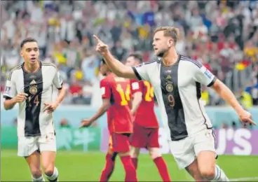 ?? AP ?? Germany striker Niclas Fuellkrug (R) celebrates after scoring against Spain at Al Bayt Stadium on Sunday.