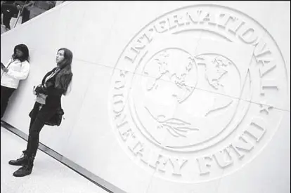  ?? REUTERS ?? Internatio­nal Monetary Fund logo is seen at the IMF headquarte­rs building during the IMF/World Bank annual meetings.