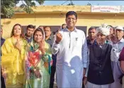  ?? PTI ?? Jannayak Janata Party (JJP) leader Dushyant Chautala, his wife Meghna Chautala and others show their finger marked with indelible ink after casting vote during Haryana Assembly elections, in Sirsa, Monday