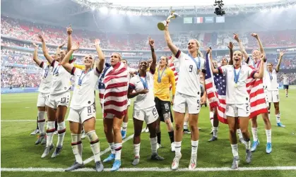  ?? Photograph: Zhizhao Wu/Getty Images ?? The US women’s team celebrate victory at the 2019 World Cup. They will earn more from the men’s campaign in 2022.