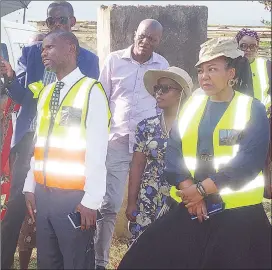  ?? (Pic: Sithembile Hlatshwayo) ?? Minister of Housing and Urban Developmen­t, Appolo Maphalala (L) and Malkerns Town Board CEO Nomathemba Masika during the tour around the area of a road project connecting the MR27 from Eagles Nest.