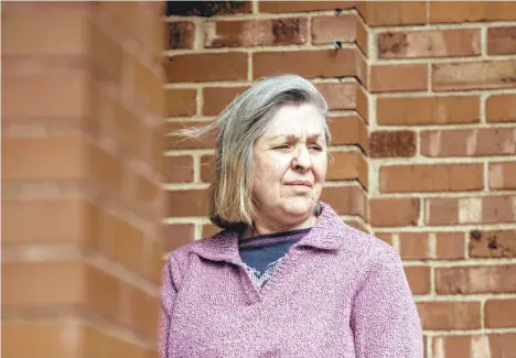  ?? NATE SMALLWOOD/TRIBUNE-REVIEW ?? Sandy Kolenda stands outside her home in Munhall, Allegheny County. She’s among thousands of victims of identify fraud through Pennsylvan­ia’s unemployme­nt system who was surprised with a tax bill for payments she did not receive.