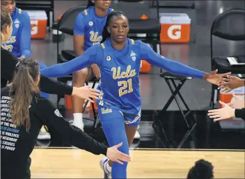  ?? ETHAN MILLER — GETTY IMAGES ?? Michaela Onyenwere is averaging 18.7 points per game for UCLA, which is 16-5 and will face Wyoming tonight.