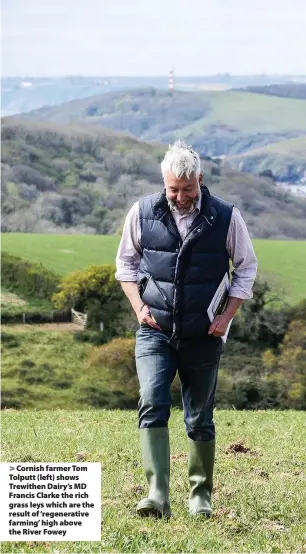  ??  ?? > Cornish farmer Tom Tolputt (left) shows Trewithen Dairy’s MD Francis Clarke the rich grass leys which are the result of ‘regenerati­ve farming’ high above the River Fowey