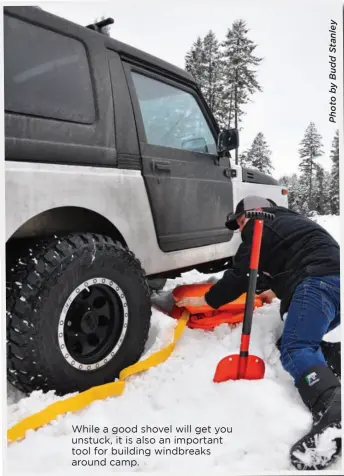  ??  ?? While a good shovel will get you unstuck, it is also an important tool for building windbreaks around camp.