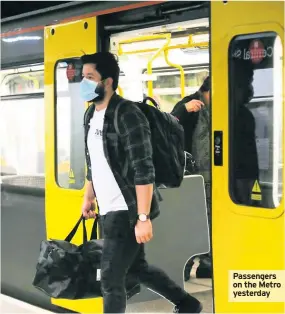  ??  ?? Passengers on the Metro yesterday