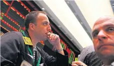  ?? /Reuters ?? Uncertaint­y:
Traders work in the crude oil and natural gas options pit on the floor of the New York Mercantile Exchange in New York.