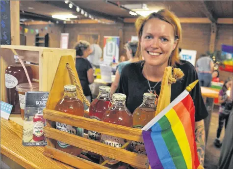  ?? SARA ERICSSON ?? Kombucha queen Gabrielle Pope of SOLAS Kombucha was one of several vendors sporting rainbow flags at their booths.