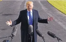  ?? SUSAN WALSH/ASSOCIATED PRESS ?? President Donald Trump talks with reporters on the South Lawn of the White House prior to departing for Camp David in Maryland for the weekend.