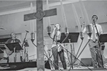  ?? Travis Long / News & Observer ?? From left, Vander Warner, Taylor Meadows and TomTom Roach rehearse during band practice at the Church on Morgan in downtown Raleigh, N.C.