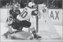  ?? Canadian Press photo ?? Vegas Golden Knights' and former Lethbridge Hurricanes captain Tyler Wong scores his first goal against Vancouver Canucks' goalie Richard Bachman during the first period of a preseason NHL hockey game in Vancouver on Sunday.