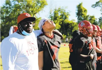  ?? JASON HIRSCHFELD/FREELANCE ?? Lake Taylor’s Darious Speight, second from left, shows his disappoint­ment after the Titans lost to Salem in the Class 4 state championsh­ip game Saturday in Norfolk.