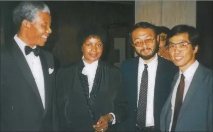  ??  ?? HISTORIC MEETING: Nelson Mandela, maWinnie Madikizela-Mandela, Yasushi Naito and Shigeaki Koga, both from the then consulate-general of Japan in Pretoria, at a reception hosted by Japan at the former Carlton Hotel in Johannesbu­rg -- the first function...