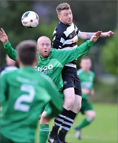  ??  ?? Dean Sheil, Quay Celtic rises highest as James Guilfoyle challenges for Duleek.