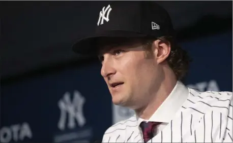  ?? MARK LENNIHAN — THE ASSOCIATED PRESS ?? Gerrit Cole is introduced as the newest Yankees player on Wednesday in New York. The pitcher agreed to a 9-year $324 million contract.