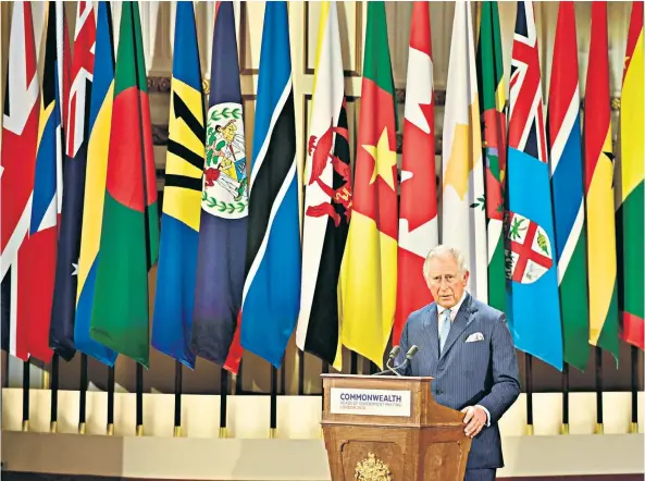  ??  ?? Taking the mantle: the Prince of Wales at the Commonweal­th summit this week, above, and with the Queen, below