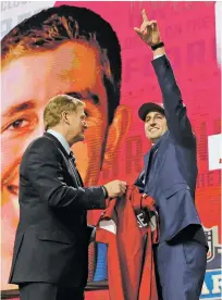  ??  ?? UCLA’s Josh Rosen, right, gestures next to Goodell after being selected by the Arizona Cardinals.