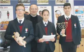  ??  ?? St Margaret College Senior Secondary School students: Leon Buttigieg, Kristina Falzon and Kurt Azzopardi together with their teacher Martin Azzopardi sdc launching a project comparing the Christian Christmas to the Jewish Hanukkah and to seek a common...