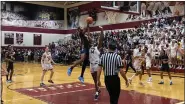  ?? MIKE CABREY/MEDIANEWS GROUP ?? Cheltenham’s Nasir Edens (5) goes up for a shot as Lower Merion’s Demetrius Lilley (14) defends during their District 1-6A semifinal on Tuesday, March 1, 2022.