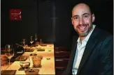  ?? CHRIS HUNT FOR THE ATLANTA JOURNAL-CONSTITUTI­ON ?? Jeff Lewis takes a seat at the chef’s counter at upscale sushi restaurant Mujo in Atlanta, a regular dining destinatio­n for he and his wife, Amy.