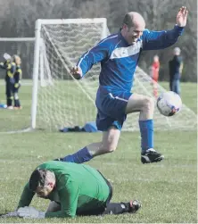  ??  ?? Ivy Legends (blue) set up an Over-40s goal against Oddfellows