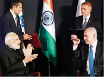  ??  ?? Indian Prime Minister Narendra Modi and his Israeli counterpar­t Benjamin Netanyahu joke during an exchange of co-operation agreements ceremony in Jerusalem on Wednesday. (Reuters)