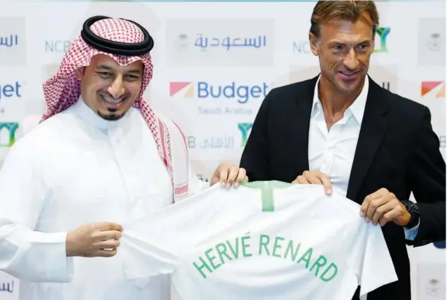  ?? Reuters ?? ↑ Newly appointed head coach Herve Renard poses with an official during the unveiling ceremony.