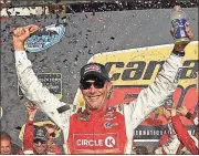  ?? Ross D. Franklin / AP ?? Matt Kenseth celebrates his win in Victory Lane after Sunday’s race at Phoenix Internatio­nal Raceway in Avondale, Ariz. The win snaps a 51-race losing streak.