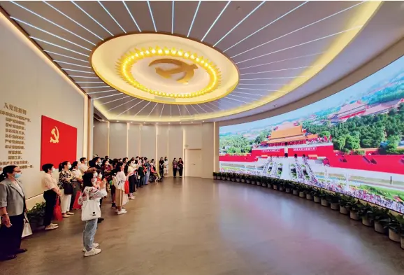  ??  ?? Visitors at the Memorial for the Site of the First National Congress of the Communist Party of China (CPC) that opened in Shanghai on June 3, 2021.