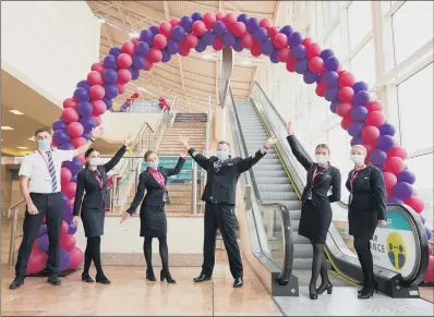  ?? PICTURE: SHAUN FLANNERY ?? FLY WITH US: Wizz Air cabin crew at Doncaster Sheffield Airport celebrate the addition of new routes at the airport.