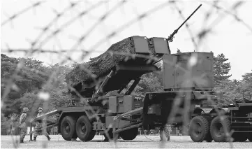  ??  ?? Japan Self-Defense Forces (JSDF) soldiers hold a drill to mobilise their Patriot Advanced Capability-3 (PAC-3) missile unit in response to recent missiles launch by North Korea, at JSDF Asaka base in Asaka, north of Tokyo. — Reuters photo